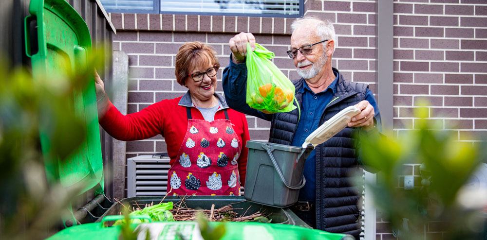 FOGO Deep Dive man and woman using FOGO bins