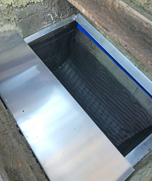 stainless steel drain buddy fitted in a stormwater drain