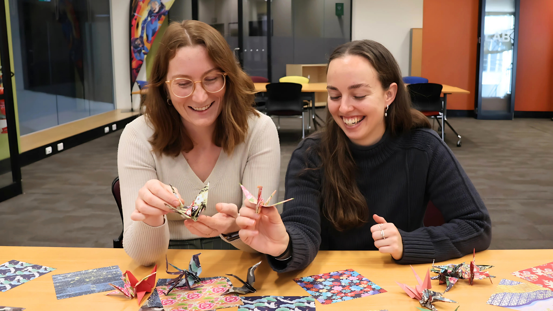 Wollongong City Libraries staff practice folding origami cranes